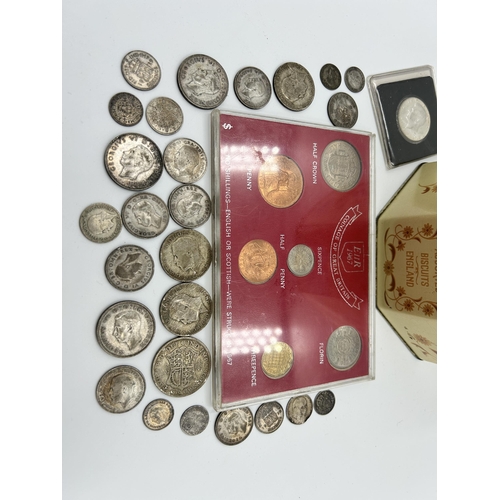 2357 - A collection of world coins with silver examples to include packaged 90% 'Kennedy' dollar, 92.5% six... 