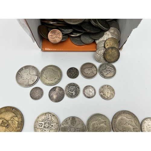 2358 - A collection of mostly British coins with silver examples to include 92.5% 1887 florin, two shilling... 