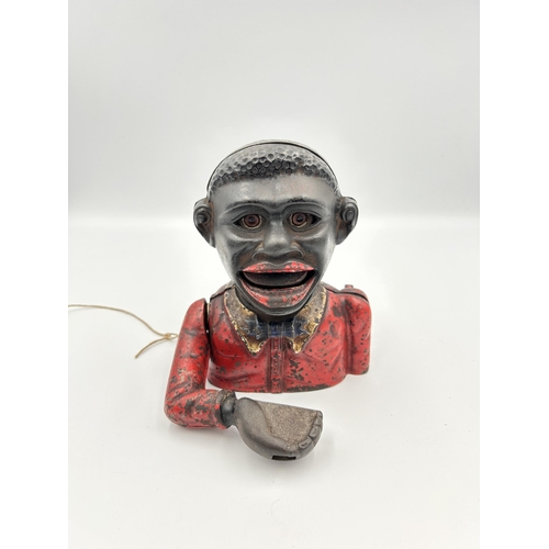 2359 - A cast iron Little Joe novelty money box - approx. 13.5cm high