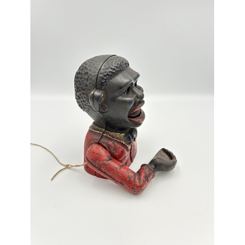 2359 - A cast iron Little Joe novelty money box - approx. 13.5cm high