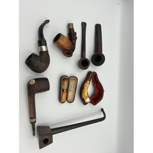 2362 - Nine pieces of tobacciana, one cased meerschaum and amber cheroot holder with hallmarked Birmingham ... 