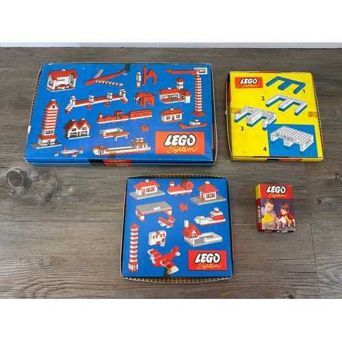 524 - Three 1950s Lego System construction sets comprising No. 306, No. 700/1 and No. 700/5 together with ... 