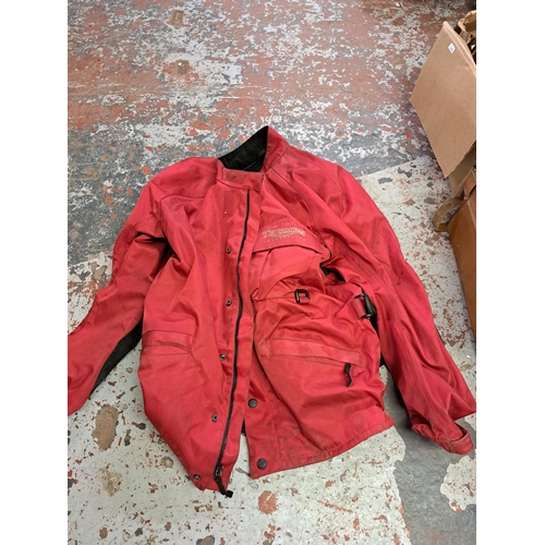 1161 - A boxed and a bag containing Triumph motorcycle jacket, a large collection of vintage motorsport rel... 