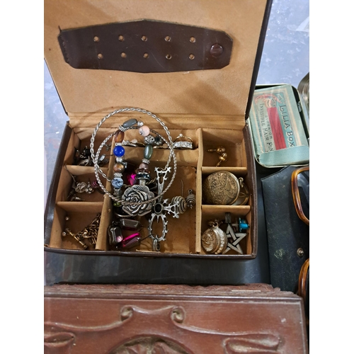 1172 - Four boxes containing costume jewellery, WWII British Defence medal with ribbon, Art Nouveau brass a... 