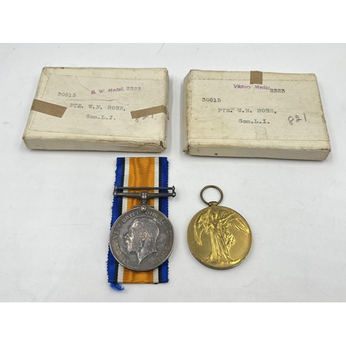 2030 - A WWI British medal pair presented to 30515 Pte. W. N. Rose Som. L. I. with two boxes