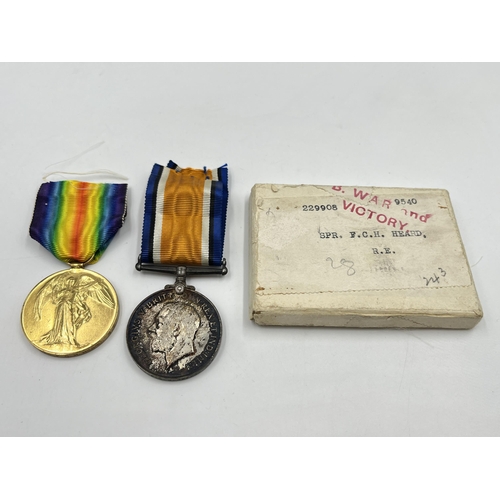 2031 - A boxed WWI British medal pair presented to 229908 Spr. F. C. H. Heard R. E.