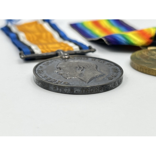 2037 - A boxed WWI British medal pair presented to 24250 Pte. H. Thorpe. R. Lanc. R.