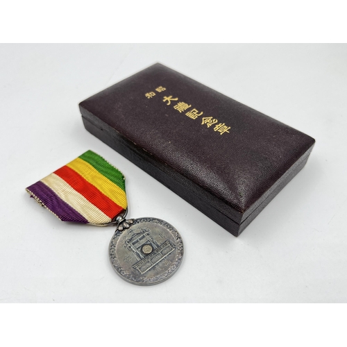 2056 - A boxed WWII Japanese Showa Enthronement medal