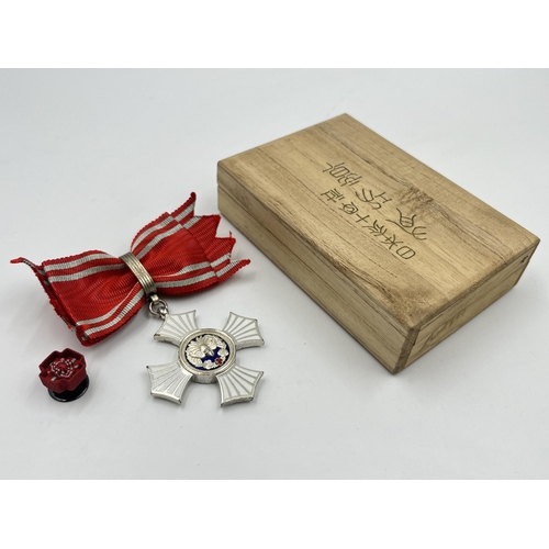 2066 - A boxed Japanese Red Cross Silver Merit medal