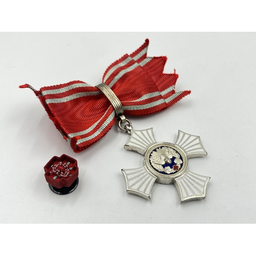 2066 - A boxed Japanese Red Cross Silver Merit medal