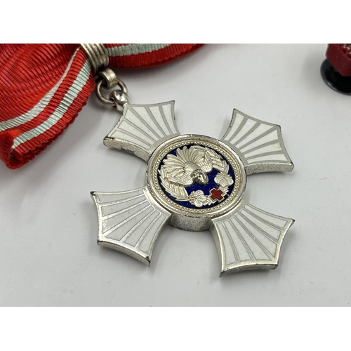 2066 - A boxed Japanese Red Cross Silver Merit medal