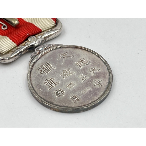 2068 - A boxed Japanese 1915 Taisho Enthronement commemorative medal