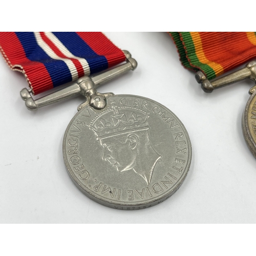 2090 - Two WWII medals presented to W157354 V. R. Quitowitz, one War and one Africa Service