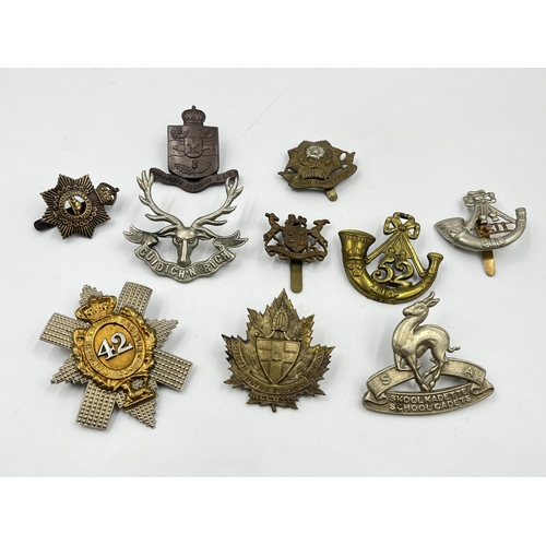 2092 - Ten military cap badges to include East Yorkshire, South African School Cadets, Canadian Army Servic... 