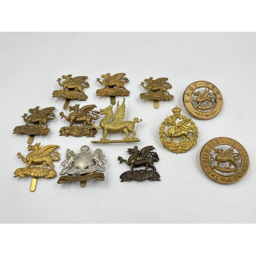 2093 - Twelve military cap badges to include The Buffs, East Kent etc.