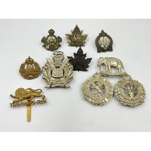 2094 - Ten military cap badges to include The King's Own, Canadian Forestry Battalion, Seaforth Highlanders... 