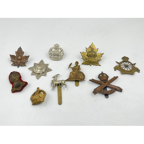 2109 - Ten military cap badges to include Army Cyclist Corps, Canadian Machine Gun Corps etc.