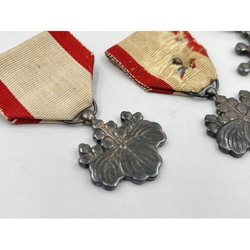 2124 - Three WWII Japanese medals, two Order of The Rising Sun 8th Class and one Order of the Sacred Treasu... 