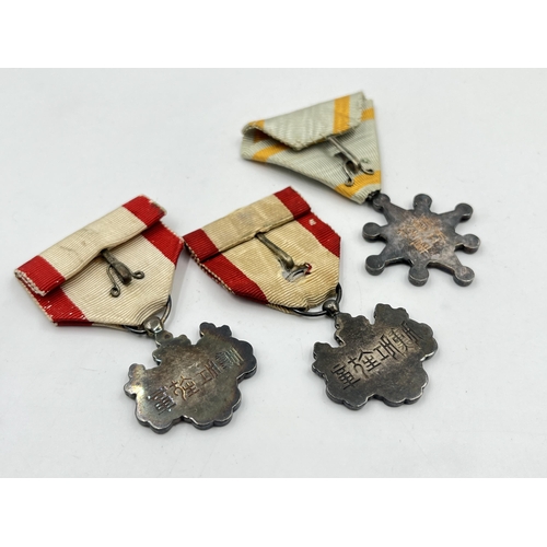 2124 - Three WWII Japanese medals, two Order of The Rising Sun 8th Class and one Order of the Sacred Treasu... 