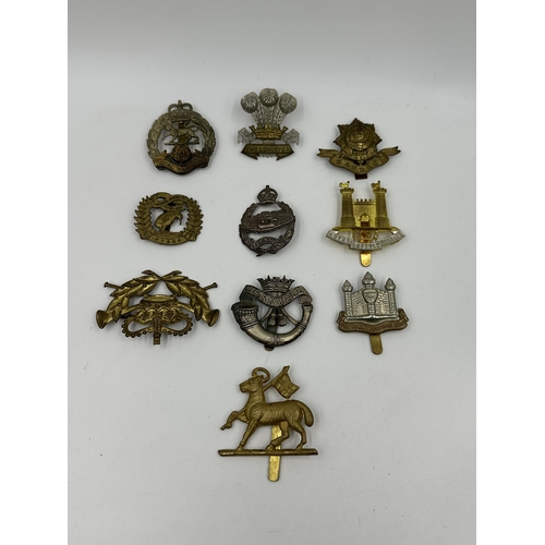 2137 - Ten military cap badges