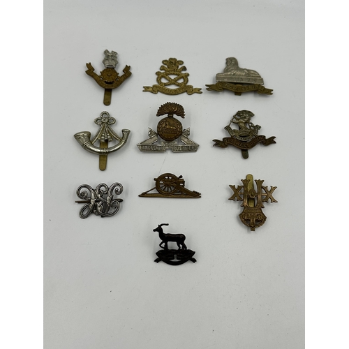 2139 - A collection of military cap badges