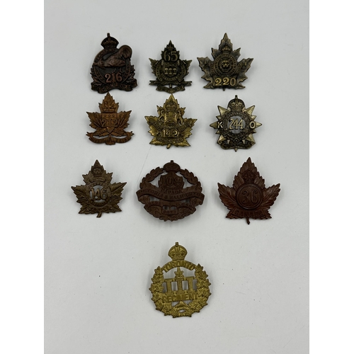 2140 - A collection of military cap badges