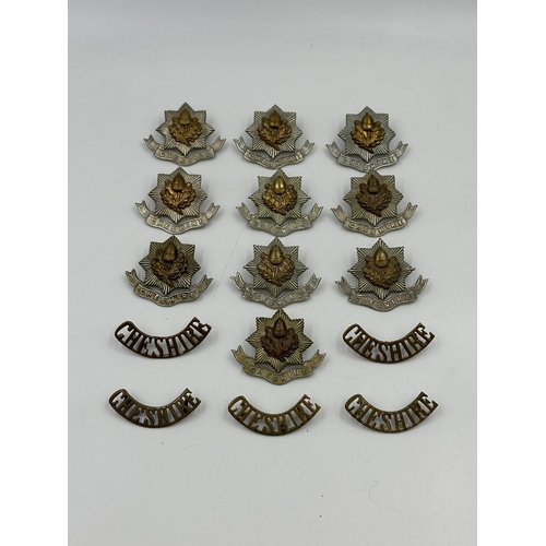 2143 - A collection of military cap badges