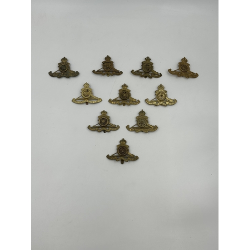 2181 - A collection of military cap badges