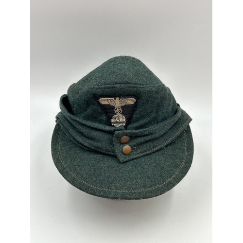 2230 - A WWII Waffen SS M43 ski cap with 