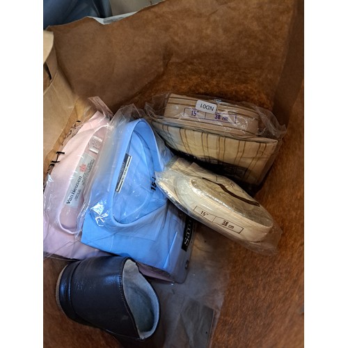 1179A - A bag containing a collection of sealed men's shirts and slippers