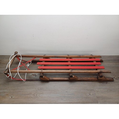 509 - Two vintage wooden sledges