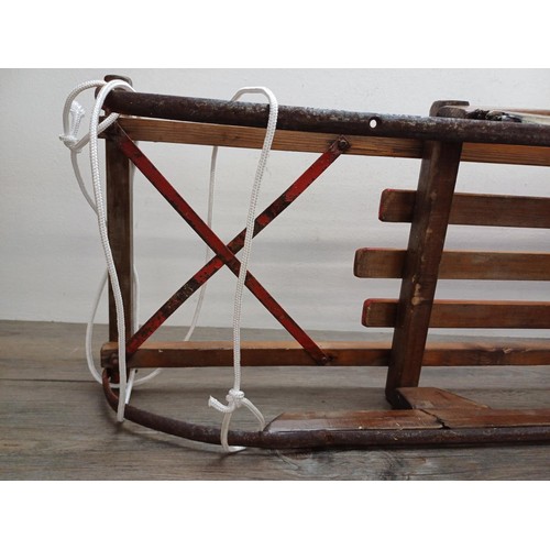 509 - Two vintage wooden sledges