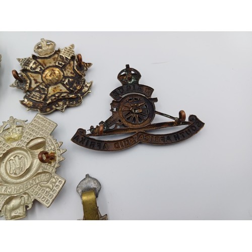 2114 - Ten military cap badges to include Argyll and Sutherland, The Robin Hoods, The Cameronians etc.