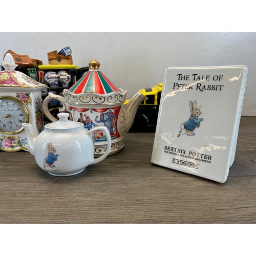 561 - Nine pieces of ceramics to include Wedgwood Beatrix Potter The Tale Of Peter Rabbit moneybox, Royal ... 