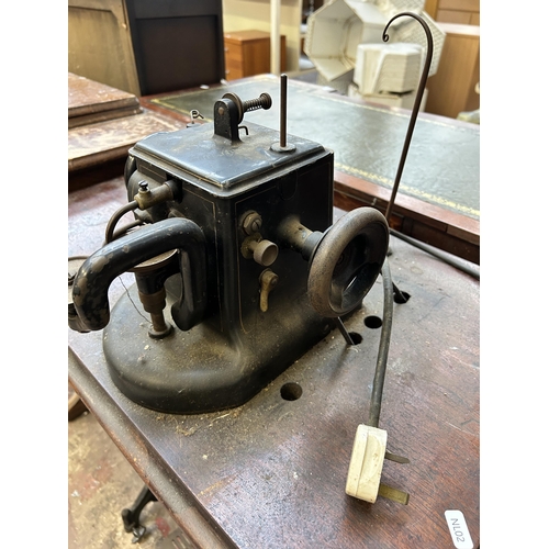 69 - An early 20th century Allbook & Hashfield Ltd. leather/fur treadle sewing machine