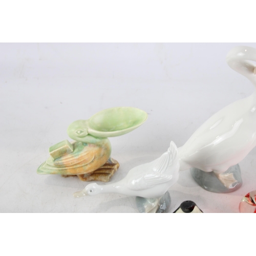 338 - Eight pieces of bird design ceramics and glassware to include Lladro, Sylvac etc.