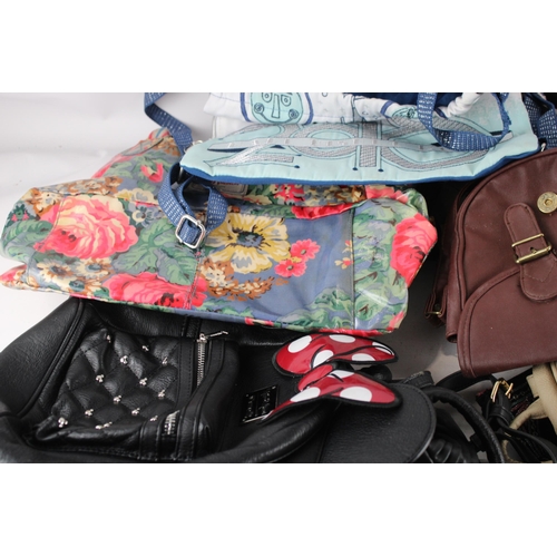 437 - A collection of ladies handbags and purses