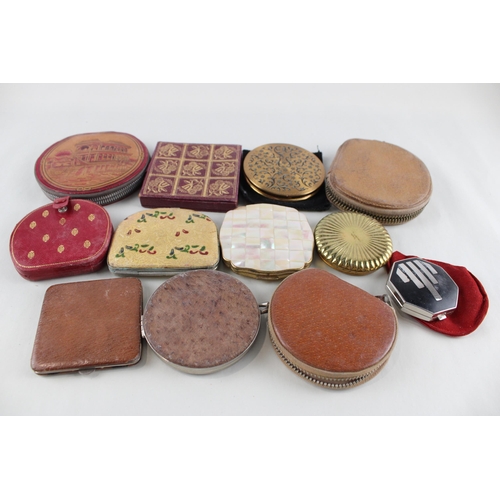 447 - Twelve assorted powder compacts