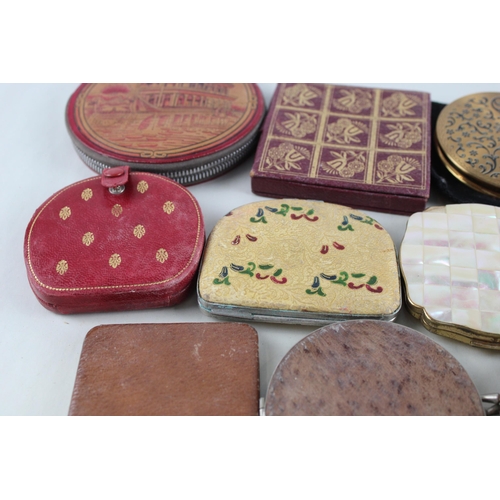 447 - Twelve assorted powder compacts