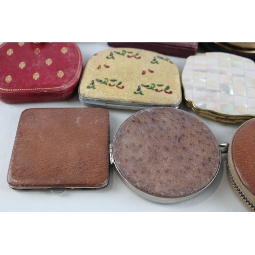 447 - Twelve assorted powder compacts