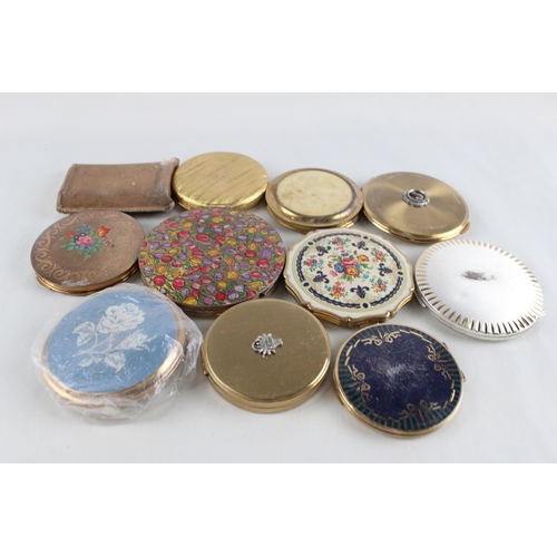 448 - Eleven assorted powder compacts