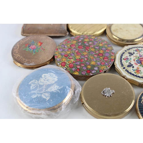 448 - Eleven assorted powder compacts