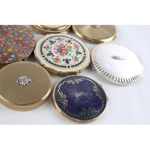 448 - Eleven assorted powder compacts