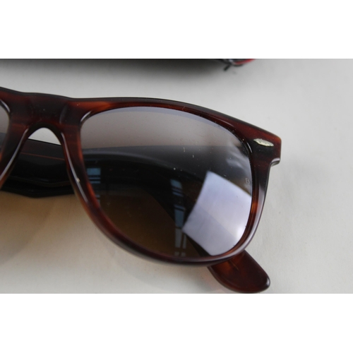 454 - A pair of cased Bausch & Lomb Ray-Ban Wayfarer II tortoiseshell effect sunglasses