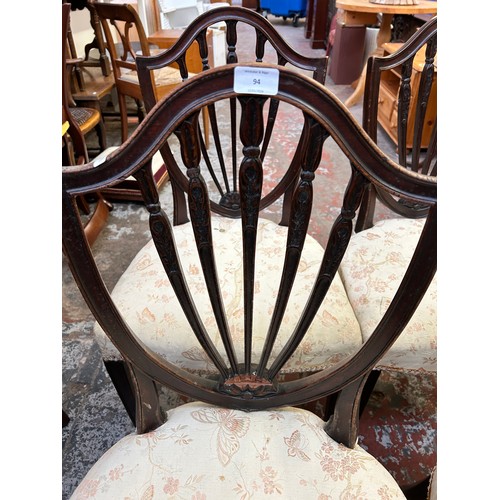 90 - Four 19th century mahogany shield back dining chairs