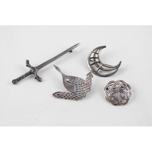 2046 - Four silver Scottish design brooches - approx. gross weight 30g