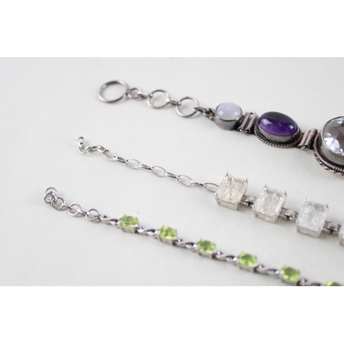 2055 - Three silver gemstone set bracelets to include moonstone, peridot etc. - approx. gross weight 40g