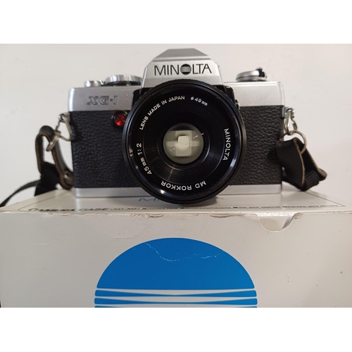 528 - A cased early 1980s Minolta XG-1 35mm SLR camera fitted with MD Rokkor 1:2 45mm lens