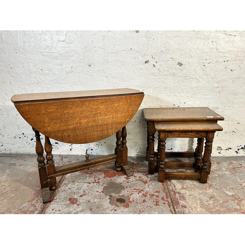 166 - Two pieces of oak furniture, one nest of tables and one oval drop leaf gate leg side table