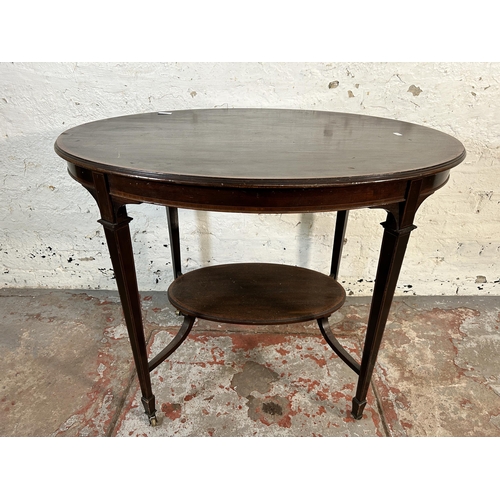 203 - An Edwardian inlaid mahogany oval two tier side table